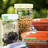 mason jars with dried fruits and granola with tough tops on