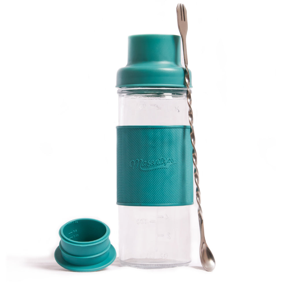 mason jar shaker, cap and swizzle tool on a white background