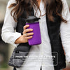 mason jar water bottle with purple sleeve being held by a woman