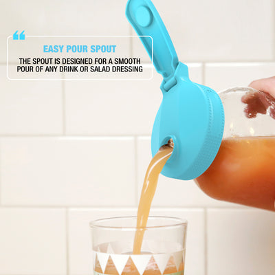 pouring orange juice from the jar with the blue multi top lid on to the glass