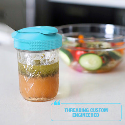 multi top lid on mason jar with a dressing inside it