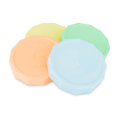 4 pastel tough tops lids in 4 different colours on a white background